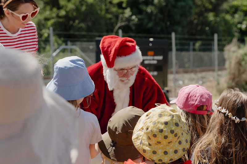 Tauranga's Christmas in the Park Free face painting, a photo booth with Santa, weaving workshops, mini golf, and Fun Football all FREE for the kids!